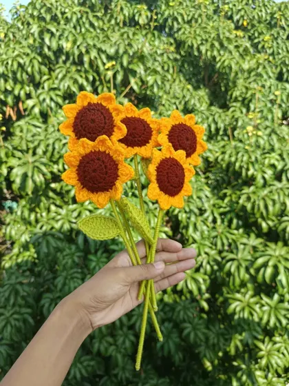 A handful of five classic sunflowers.