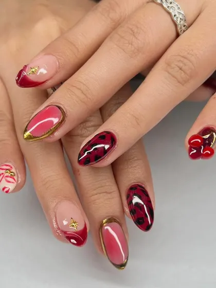 A bold and playful set with a mix of red, leopard print, 3D cherries, and gold accents.