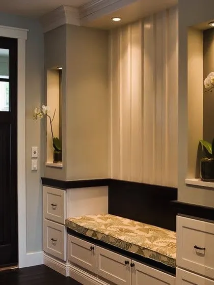 For this home in Asiad Village, I designed a welcoming entryway with a custom cushioned bench and integrated storage. This small detail adds immense practicality and sets a warm tone for the entire house.
