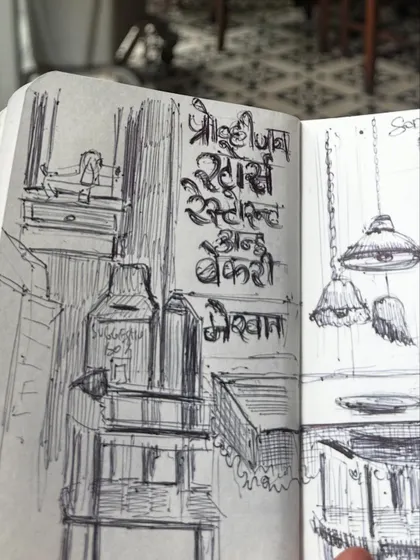 A close-up of the pen and ink sketch I did at SodaBottleOpenerWala, focusing on the Devanagari script on the wall. I love capturing these small, authentic details.