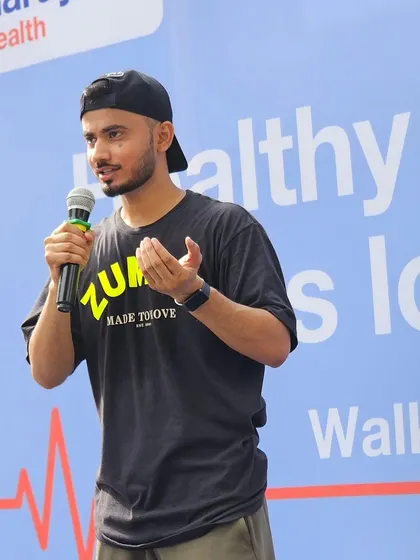 Here I am speaking to the crowd at the Narayana Health Walkathon. Our role includes motivating participants and ensuring everyone is in high spirits.