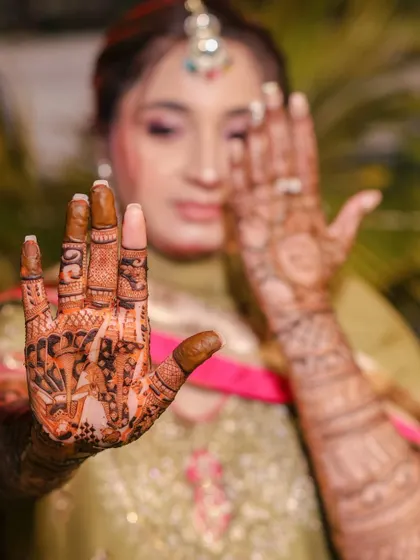 A close-up of the bride's intricate Mehndi design, a beautiful piece of temporary art.