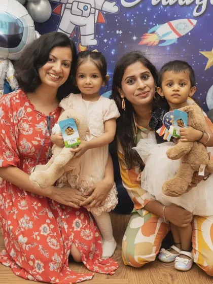Group photos that feel natural and happy. Here, two families come together for a lovely picture, documenting the friendships that are celebrated at these events.