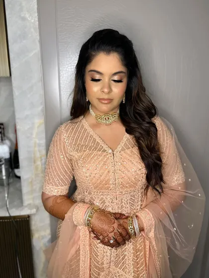 A flawless look for Simran's engagement. I used nude peach tones and a touch of shimmer to create a sophisticated and elegant style.
