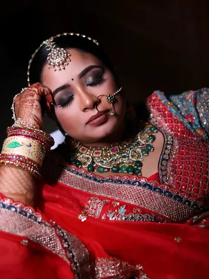 A serene portrait of a bride with her eyes closed, capturing a moment of calm and reflection on her wedding day.