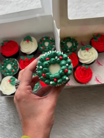 Christmas is one of my busiest times. Here's one of my festive cupcake designs, a beautiful wreath made with green buttercream and tiny sprinkles for ornaments.