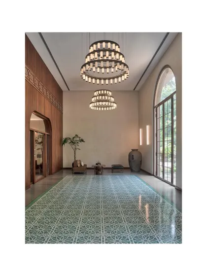 Another shot of the Artveda lobby in Mumbai. The grand chandeliers and expansive patterned floor create a sense of arrival, setting a tone of quiet luxury and artistic sensibility for the entire building.