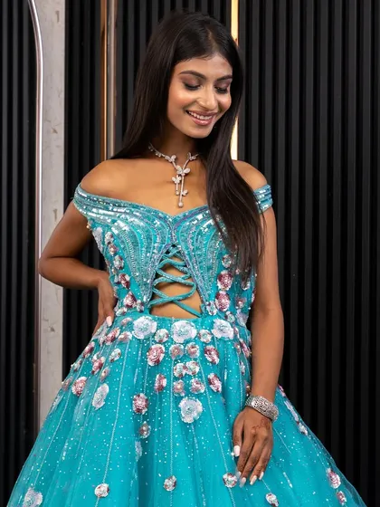 Another angle of the blue ball gown, highlighting the lace-up corset detail on the bodice. It's these small details that make my rental outfits special.