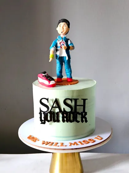 A farewell cake with a personal touch. I created a custom figurine of the person leaving, complete with their signature style, to make for a memorable and heartfelt send-off.