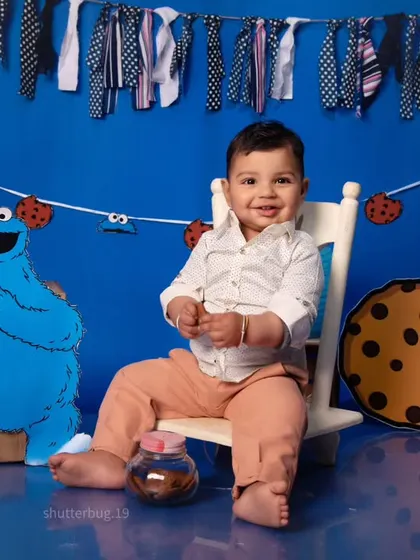 This little one is enjoying a jar of cookies in our fun Cookie Monster themed setup.