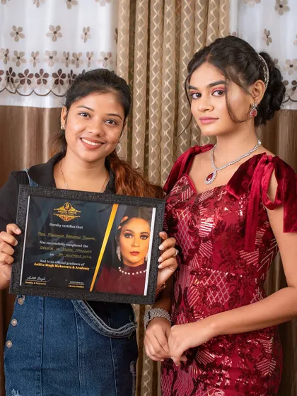 A student and her model showcasing a glamorous reception look for the portfolio. My courses cover everything from traditional bridal to modern party makeup.