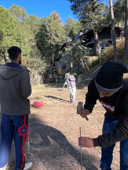 Precision is crucial when working with natural landscapes. My team uses surveying equipment to map out the site, a foundational step that informs every design decision for this upcoming project in the hills.