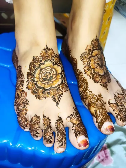 A side view of the elegant floral foot design, highlighting the way the pattern wraps around the foot.