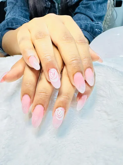 A soft and pretty design with a pink sugar-effect base and delicate hand-painted white roses.