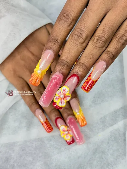 A vibrant and playful set featuring multiple 3D techniques. I combined textured patterns, sculpted flowers with pearl centers, and glossy gel finishes in a warm color palette of orange, pink, and yellow.