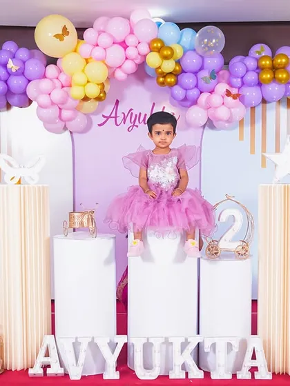 A magical 'Unicorn' themed birthday party, with pastel colors, shimmering backdrops, and unicorn illustrations, creating a whimsical and dreamy atmosphere.