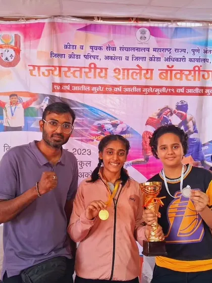 Coach with our state champions Nishi Patel (Gold) and Sanaya Yadav (Silver). We guide our fighters to the podium.