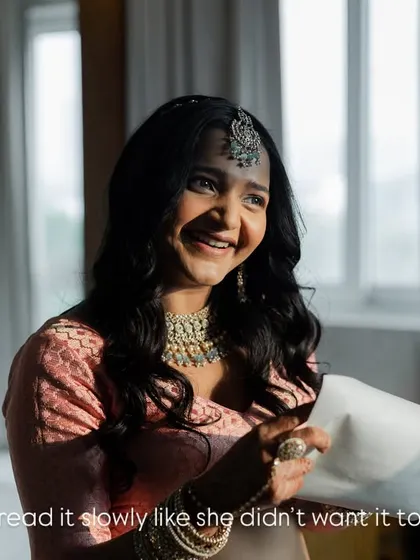The pure joy on a bride's face as she reads a letter from her love. She read it slowly, as if she didn't want the moment to end, a beautiful, private smile just for him.