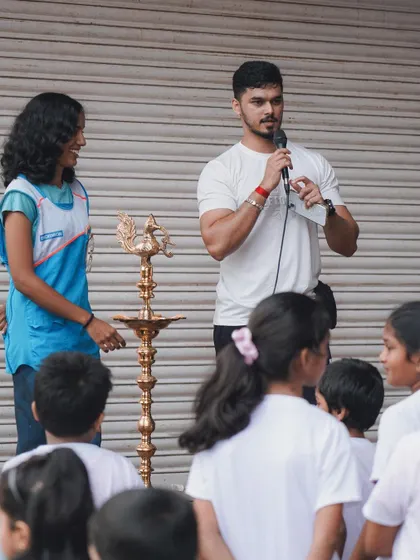 Addressing the young participants and their parents before the start of the walkathon, explaining the importance of an active lifestyle.