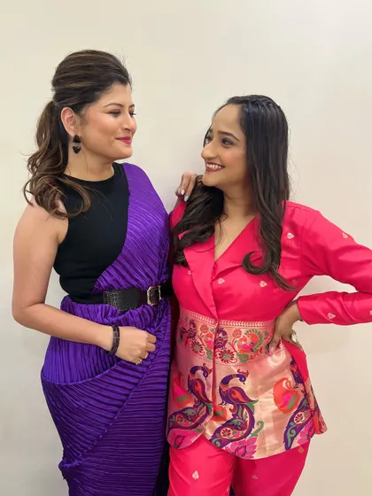 A sweet moment of friendship captured on the red carpet. Both artists look radiant and confident with their custom makeup looks.