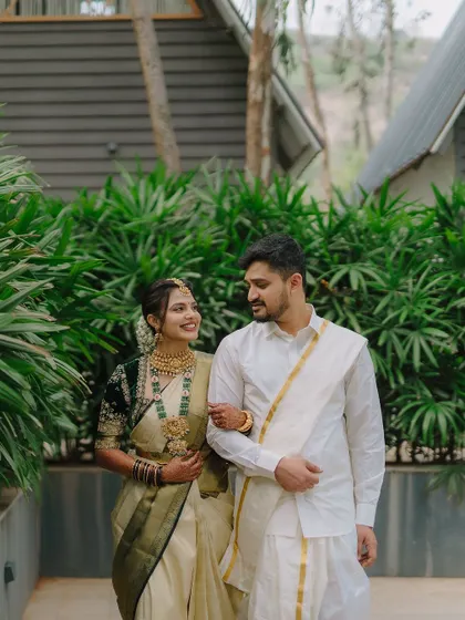A candid shot of a couple taking a stroll together on their wedding day. These relaxed, in-between moments often make for the most beautiful and natural portraits.