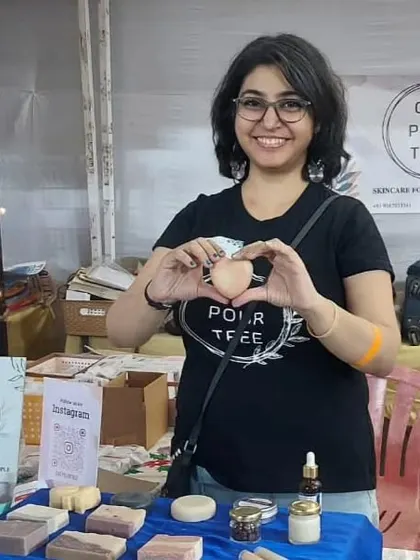 Making a heart with my hands and a 'Juliet' soap at the Inodai School event. This picture captures the love I have for my craft and my customers.