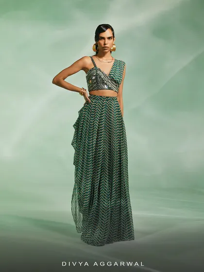 A modern take on the green print, this co-ord set features a drape skirt and an embellished asymmetrical blouse.
