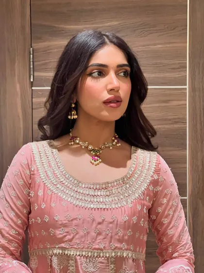 Another close-up of Bhumi's festive look, focusing on her flawless makeup and the intricate details of her necklace.