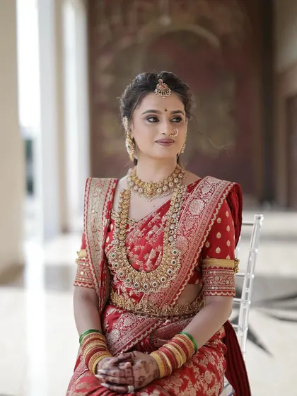 My stunning bride Daneshwari, looking absolutely regal for her muhurtham. She is wearing a beautiful red Sabyasachi saree, and I created a classic look with defined eyes and radiant skin to match.