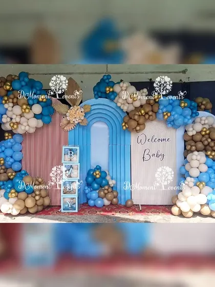 The full view of the baby welcome stage, showcasing the beautiful balloon garlands and the "Welcome Baby" sign.