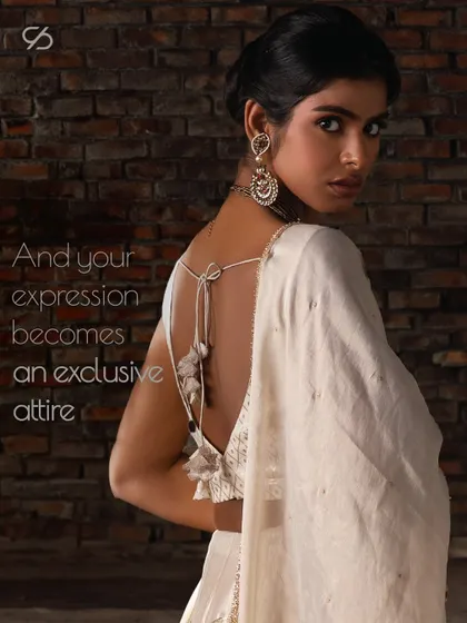 Your expression becomes an exclusive attire. The deep back of this blouse, adorned with delicate tassels, is a perfect example of how I tailor each piece to your unique style.