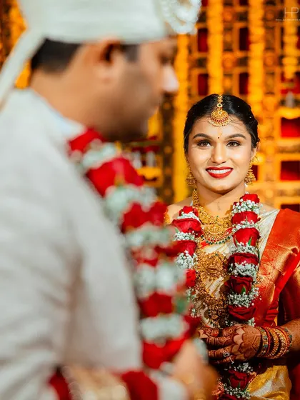 A beautiful over-the-shoulder shot of the bride looking at her groom during the ceremony.