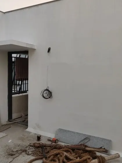 Another "before" shot of the terrace, showing the plain wall and empty space that would soon become the stylish bar and lounge area.
