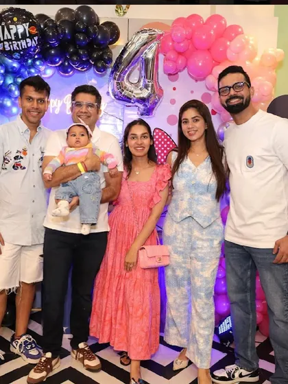 A group of friends and family enjoying a stylish birthday celebration.