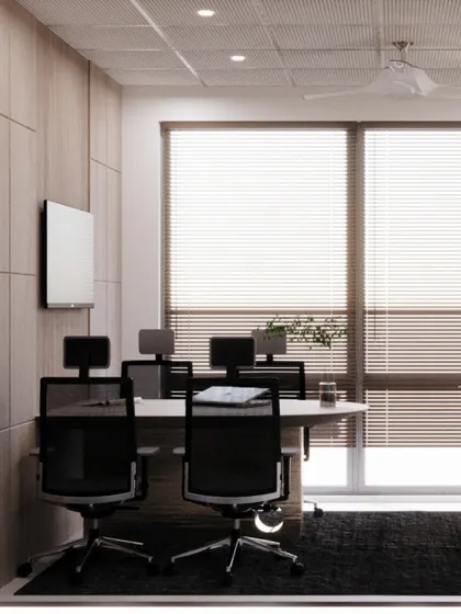 This view of a conference room shows how we use natural light and clean design to create a bright and airy workspace. The wood paneling adds warmth and texture to the professional setting.
