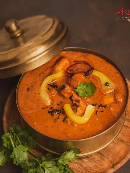 Our Tandoori Chicken Tikka Masala is a crowd-pleaser. Smoky tandoori chicken pieces are simmered in a creamy, flavourful tomato-based gravy. It's the perfect main course for any event.
