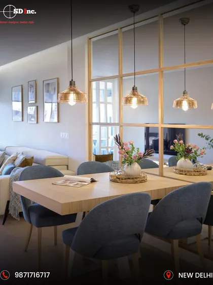 This bright and airy dining space uses a large mirror-paneled wall to create an illusion of spaciousness. The simple wooden dining table is paired with comfortable upholstered chairs, perfect for a modern, minimalist home.