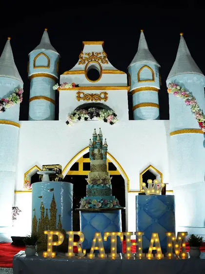 A magnificent castle backdrop for Prince Pratham's first birthday. This large, custom-built castle prop created a stunning focal point for the outdoor celebration.