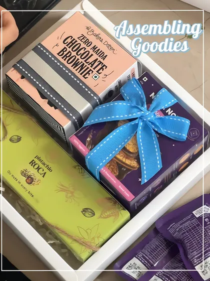 Assembling the goodies for the birthday return favors. Each box was carefully packed with treats like pistachio roca and chocolate brownies.