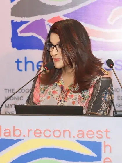 A Passion for Education and Advancement. A close-up of me at the podium during the Oculoplastic Conference, sharing my passion for advancing the fields of dermatology and hair restoration.