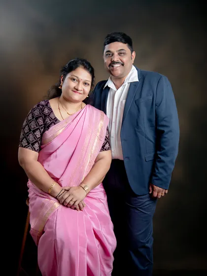 A formal portrait of a couple against our classic studio backdrop. This is a timeless way to document your journey together.