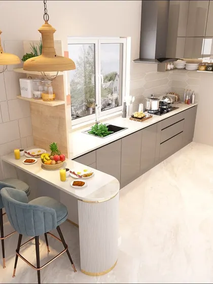 A cozy breakfast nook is integrated into this kitchen design, complete with stylish teal bar stools. It's the perfect spot for a quick meal or a morning cup of coffee, with a view out the window.