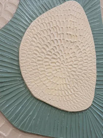 A close-up of the intricate textures on the layered board art. I use tools to carve and shape the textural paste, creating patterns that are both visually and tactilely interesting.