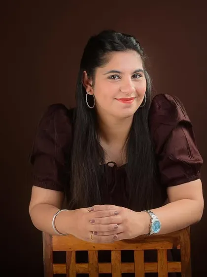A beautiful close-up portrait with a friendly smile. This is the kind of warm and engaging photo that makes a great first impression on a matrimony site.
