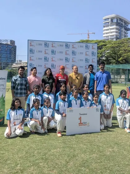 A group photo marking a memorable day. Our players and coaches with cricket stars, an experience that reinforces their passion for the sport.
