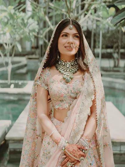 A beautiful portrait of Tanisha for her phera ceremony. Her makeup is soft and subtle, with a gentle focus on the eyes and a natural lip color, letting her stunning Anamika Khanna outfit shine.