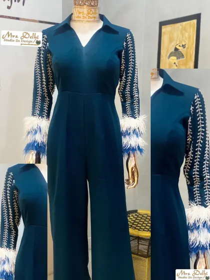 A full view of our stylish royal hand-worked jumpsuit. The combination of embroidery and feathers makes this a truly unique and luxurious piece.