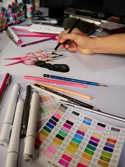 A look at my workspace while drawing Power. You can see my collection of Ohuhu markers and Prismacolor pencils, which are my go-to materials for creating vibrant character art.