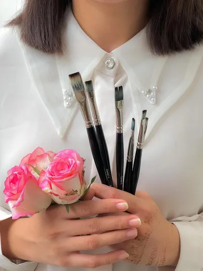 My hands, my tools, and a few flowers. This is my world in a single frame.