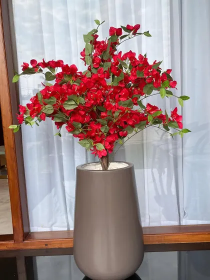 Add a pop of permanent color with our artificial Bougainvillea. This vibrant red plant looks stunning in a modern grey planter and will stay in full bloom all year round.